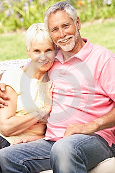 Senior Couple Relaxing In Garden