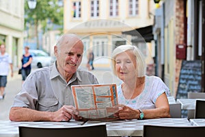 Senior couple relaxing in outdoors cafe