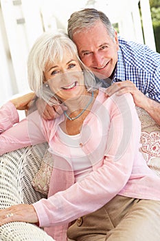 Senior Couple Relaxing Together On Sofa