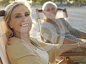 Senior Couple Relaxing On Tropical Beach