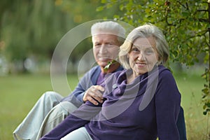 Senior couple resting outdoors