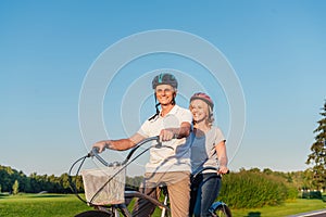 Senior couple riding bicycle