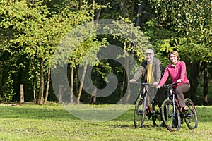 Senior couple riding bicycles