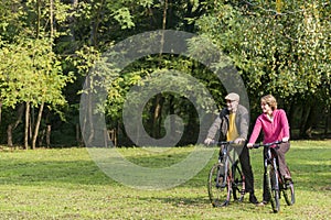 Senior couple riding bicycles