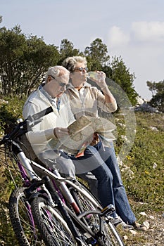 Senior couple riding a bike