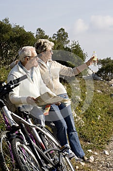 Senior couple riding a bike