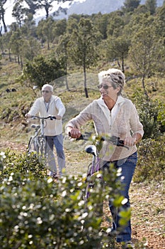 Senior couple riding a bike