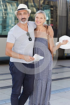 senior couple roaming around in foreign city