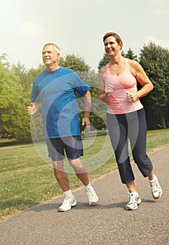 Senior couple running.