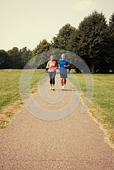 Senior couple running.