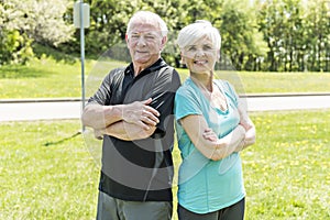 Senior couple running in park