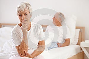 Senior, couple and sad in bedroom with conflict, ignore and crisis in marriage for mental health or retirement. Elderly