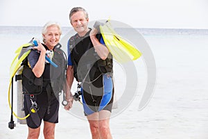 Senior Couple With Scuba Diving Equipment Enjoying Holiday