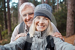 Senior couple, selfie and portrait, hiking in forest and happy people in nature and memory for social media post. Smile