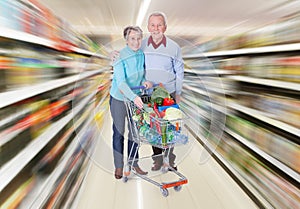 Senior couple with a shopping cart