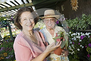 Senior Couple Shopping for flowers at plant nursery portrait