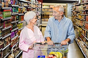 Senior couple shopping in grocery store