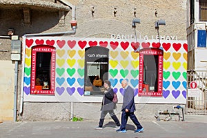 February 2019, Elderly Israeli couple walking artistic Rothschild boulevard, Tel Aviv