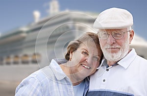 Senior Couple On Shore in Front of Cruise Ship