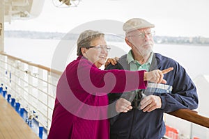 Senior Couple Sight Seeing on The Deck of a Cruise Ship