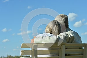 Senior couple sitting on bench