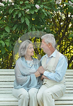 Senior couple sitting on bench