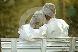 Senior couple sitting on bench