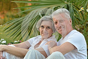 Senior couple sitting at garden