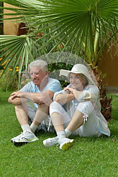 Senior couple sitting at hotel garden