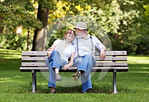 Senior couple sitting on a park bench