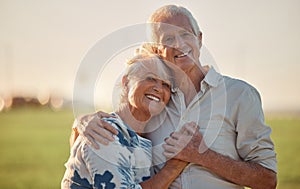 Senior couple smile and happy with love outdoor at a forest, care and hug. Elderly man and woman portrait, happiness and