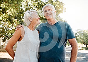 Senior couple smile after running for exercise, fitness and health in retirement together. Elderly runners rest after