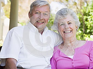 Senior couple smiling at camera
