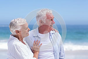 Senior couple smiling and looking away