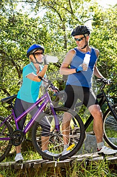 Senior couple standing with their bikes