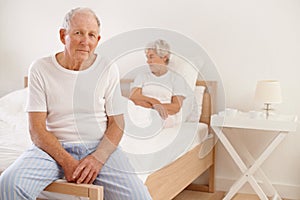 Senior, couple and stress in bedroom with conflict, ignore and crisis in marriage for mental health and retirement