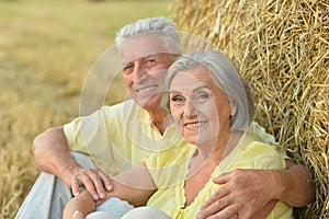 Senior couple at summer field