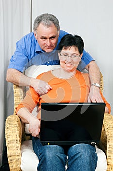 Senior couple surfing Internet