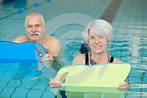 Senior couple in swimming pool