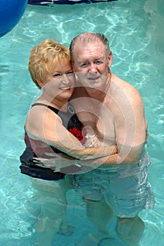 Senior couple in swimming pool