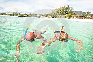 Senior couple swimming on tropical paradise beach in Koh Lipe