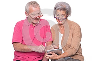 Senior couple with tablet