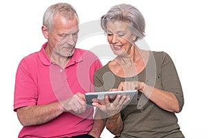 Senior couple with tablet