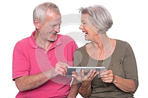 Senior couple with tablet