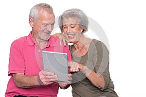 Senior couple with tablet