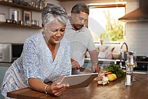 Senior couple, tablet and cooking in kitchen with healthy food, online search and app for nutrition in home. Digital