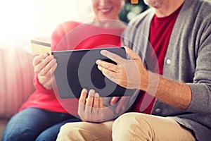 Senior couple with tablet pc shopping online