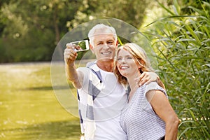 Senior couple taking selfie