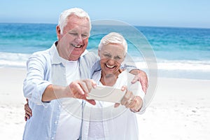 Senior couple taking a selfie