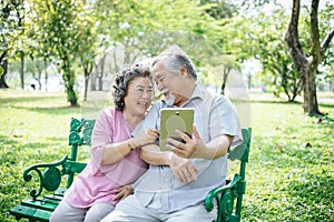 Senior couple taking a selfie photo with smart phone